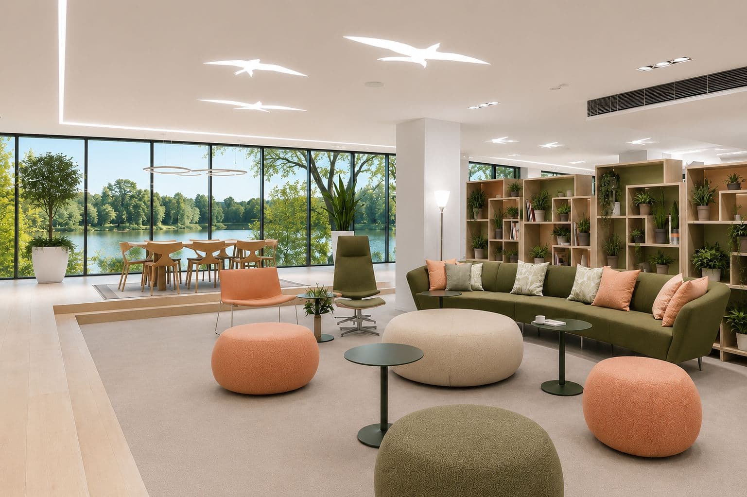 Welcoming lounge with moss green sofa, peach seating, bookshelf with plants and lake view